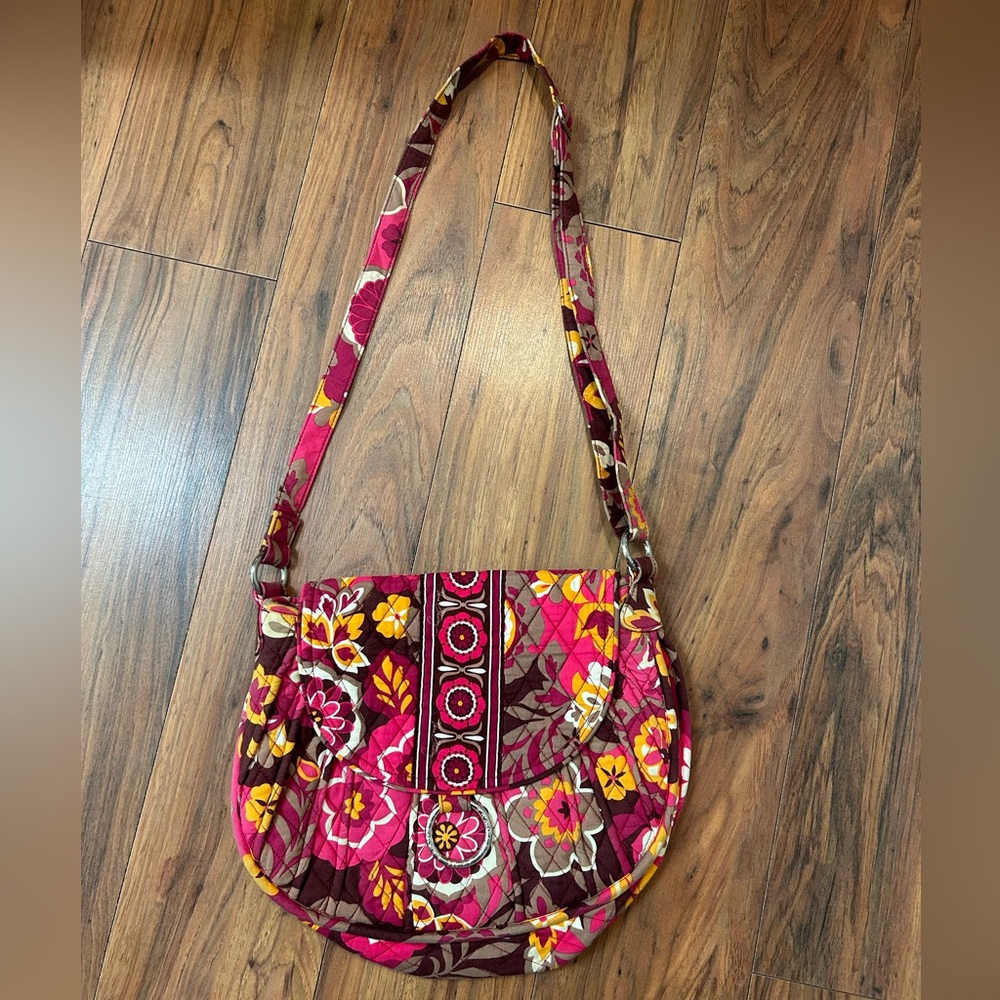 Vera Bradley purse. Crossbody. Bright flower print. Cloth. Flap open.